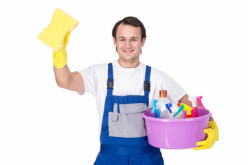 Worker placing safety controls around a freshly cleaned floor